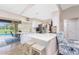 Bright kitchen with white cabinets, stainless steel appliances, and a breakfast bar at 4227 Winona St, Port Charlotte, FL 33948