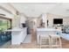 Bright kitchen featuring white cabinets, stainless steel appliances, and a breakfast bar with seating at 4227 Winona St, Port Charlotte, FL 33948