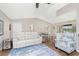 Inviting living room featuring a white leather sofa and hardwood floors, open to the dining area at 4227 Winona St, Port Charlotte, FL 33948