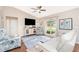 Inviting living room with a comfortable sofa, large window, and stylish decor at 4227 Winona St, Port Charlotte, FL 33948
