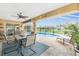 Covered patio with comfortable seating and a view of the pool and backyard at 4227 Winona St, Port Charlotte, FL 33948