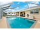 A refreshing pool within a screened enclosure, offering privacy and relaxation in the backyard at 4227 Winona St, Port Charlotte, FL 33948