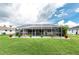 A lovely backyard with a screened-in pool and neat landscaping, offering a serene retreat at 4227 Winona St, Port Charlotte, FL 33948