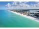 Breathtaking aerial view showcasing the pristine beach, azure waters, and stunning coastal landscape at 50 Meredith Dr # 9, Englewood, FL 34223