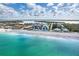 Beautiful aerial view of the beach and beachfront condos with clear turquoise water at 50 Meredith Dr # 9, Englewood, FL 34223