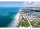 Beachside condo with white sand beach, green foliage, and stunning blue water views at 50 Meredith Dr # 9, Englewood, FL 34223