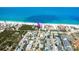 Coastal condo near the beach with nearby residential properties, foliage, and sandy shoreline at 50 Meredith Dr # 9, Englewood, FL 34223