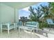 Relaxing balcony with stylish outdoor furniture, offering a serene place to unwind at 50 Meredith Dr # 9, Englewood, FL 34223