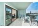 Inviting outdoor balcony features comfortable seating with views of the building and neighborhood at 50 Meredith Dr # 9, Englewood, FL 34223