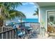 Balcony with comfortable seating and breathtaking views of the ocean and nearby beach at 50 Meredith Dr # 9, Englewood, FL 34223
