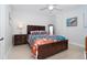 Brightly lit bedroom with neutral walls, modern wooden furniture, and a comfortable bed at 50 Meredith Dr # 9, Englewood, FL 34223