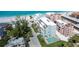 Condo exterior featuring a swimming pool, balconies, and well-maintained landscaping at 50 Meredith Dr # 9, Englewood, FL 34223