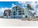 Beachfront condo featuring balconies and manicured landscaping at 50 Meredith Dr # 9, Englewood, FL 34223