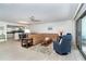 Open-concept floor plan with living room, dining area, and updated kitchen, perfect for entertaining at 50 Meredith Dr # 9, Englewood, FL 34223