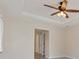 Bedroom featuring a tray ceiling, ceiling fan, and neutral paint at 5781 Elton Rd, Venice, FL 34293