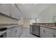 Bright kitchen showcases granite countertops, stainless steel appliances, and tile flooring at 5781 Elton Rd, Venice, FL 34293