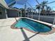 Screened-in pool area perfect for outdoor entertaining with clear blue water and ample deck space at 5781 Elton Rd, Venice, FL 34293