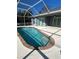 Inviting pool area under a screen enclosure offering a refreshing escape and plenty of sunshine at 5781 Elton Rd, Venice, FL 34293