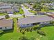 Aerial view of the home, showcasing the large backyard, patio and landscaping at 609 Deerwood Ave, Englewood, FL 34223