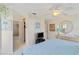 Bedroom showcasing a queen size bed, ceiling fan, and en suite bathroom and closet at 609 Deerwood Ave, Englewood, FL 34223