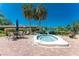 Outdoor hot tub featuring brick patio and lush green landscaping. Relaxing and inviting area at 609 Deerwood Ave, Englewood, FL 34223