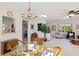 Bright living and dining area featuring light walls, ceiling fan, comfortable seating and lots of natural light at 609 Deerwood Ave, Englewood, FL 34223