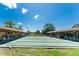 Shuffleboard courts with covered seating on a sunny day, great for friendly competition at 609 Deerwood Ave, Englewood, FL 34223