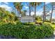 Community sign for Foxwood surrounded by well maintained landscaping at 609 Deerwood Ave, Englewood, FL 34223