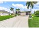 Beautiful single-story home with an attached two-car garage, landscaping, and concrete driveway at 7130 Scarlet Sage Ct, Punta Gorda, FL 33955