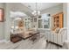 Cozy living room with comfortable seating, hardwood floors, and lots of natural light at 7130 Scarlet Sage Ct, Punta Gorda, FL 33955