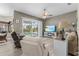 Comfortable living room with a sliding glass door to the lanai and pool area with wicker and upholstered furniture at 7130 Scarlet Sage Ct, Punta Gorda, FL 33955