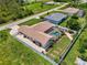 This aerial view showcases the fenced in back yard with a pool and mature landscaping at 7218 Darlington St, Englewood, FL 34224