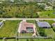 Aerial view of home: swimming pool and mature landscaping at 7218 Darlington St, Englewood, FL 34224