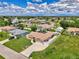 A beautiful single Gathering home featuring a spacious yard, driveway, and mature landscaping at 7218 Darlington St, Englewood, FL 34224