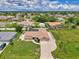 Expansive aerial view showcases the home's well-kept lawn and neighborhood setting at 7218 Darlington St, Englewood, FL 34224