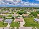 Aerial view showcases the home's well-kept lawn and neighborhood setting at 7218 Darlington St, Englewood, FL 34224