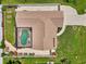 Aerial rooftop view of a screen enclosed pool, well manicured landscaping, and fully fenced yard at 7218 Darlington St, Englewood, FL 34224