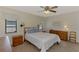 Comfortable bedroom with a bed and wooden furnishings at 7218 Darlington St, Englewood, FL 34224