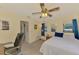Comfortable bedroom featuring a ceiling fan and a view to the exterior at 7218 Darlington St, Englewood, FL 34224