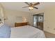 Bright bedroom features a ceiling fan and sliding door access to the lanai at 7218 Darlington St, Englewood, FL 34224