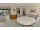 Charming dining room with neutral décor, round table, and a view of the living areas at 7218 Darlington St, Englewood, FL 34224