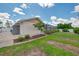 Landscaped side yard with a screen enclosed lanai, perfect for enjoying the outdoors at 7218 Darlington St, Englewood, FL 34224