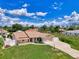 Charming single-Gathering home with well-maintained lawn and a driveway leading to a two-car garage at 7218 Darlington St, Englewood, FL 34224
