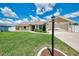 Charming single-story home with well-manicured lawn and stone accents, offering a welcoming curb appeal at 7218 Darlington St, Englewood, FL 34224