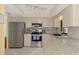 Contemporary kitchen with stainless steel appliances, granite countertops and sleek cabinetry at 7218 Darlington St, Englewood, FL 34224