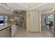 Spacious kitchen with granite countertops, and white cabinetry seamlessly connecting to other living spaces at 7218 Darlington St, Englewood, FL 34224