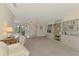 Bright living room with built-in bookshelves and natural light at 7218 Darlington St, Englewood, FL 34224