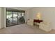 Relaxing living room with sliding glass doors to the screened lanai and pool at 7218 Darlington St, Englewood, FL 34224