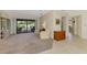 Spacious living room flows to the lanai with views of the pool at 7218 Darlington St, Englewood, FL 34224