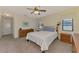 Spacious main bedroom with a ceiling fan and carpet flooring at 7218 Darlington St, Englewood, FL 34224